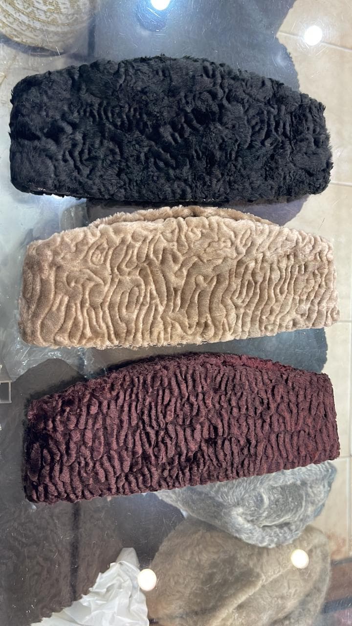 Karakul caps in black, cream and maroon curled wool