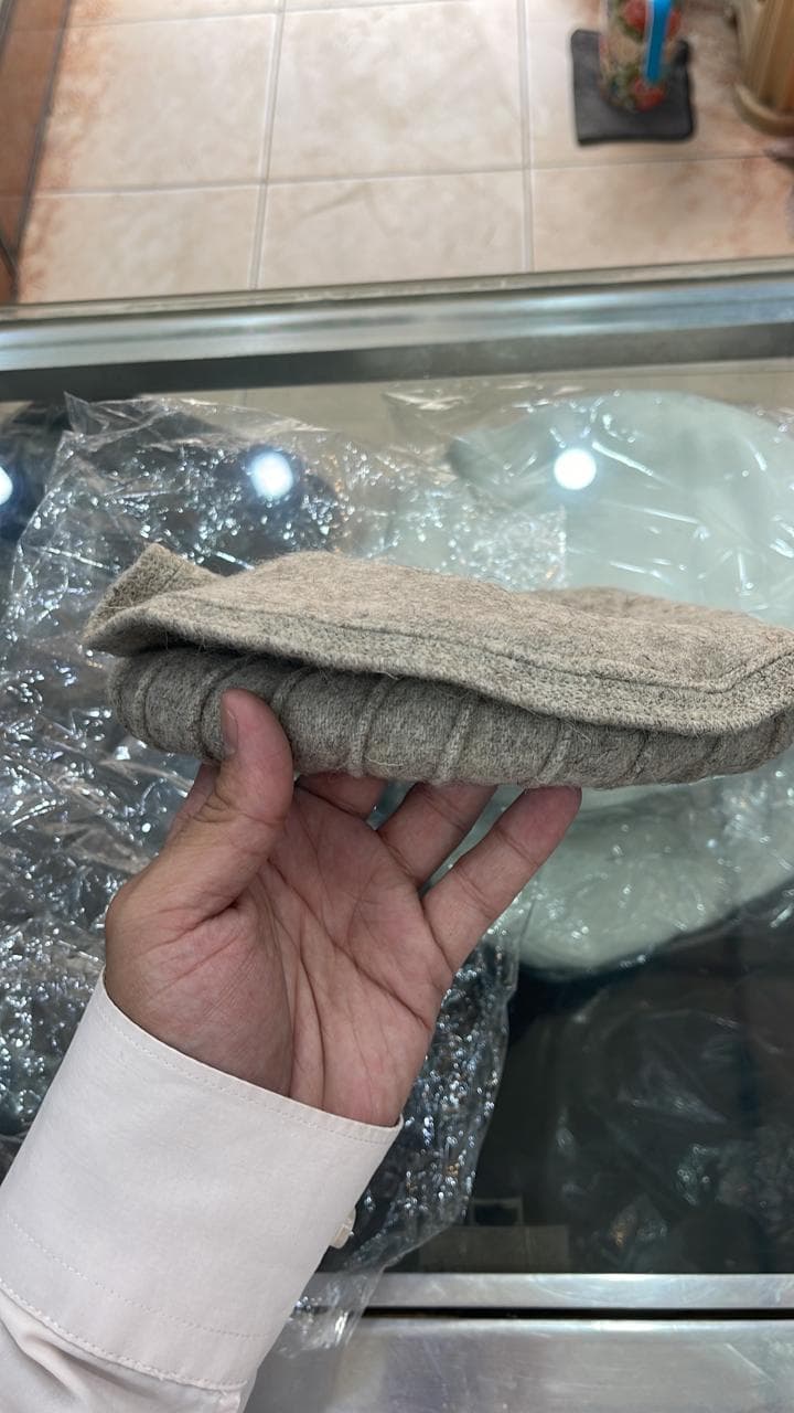 Beige wool felt topi, folded